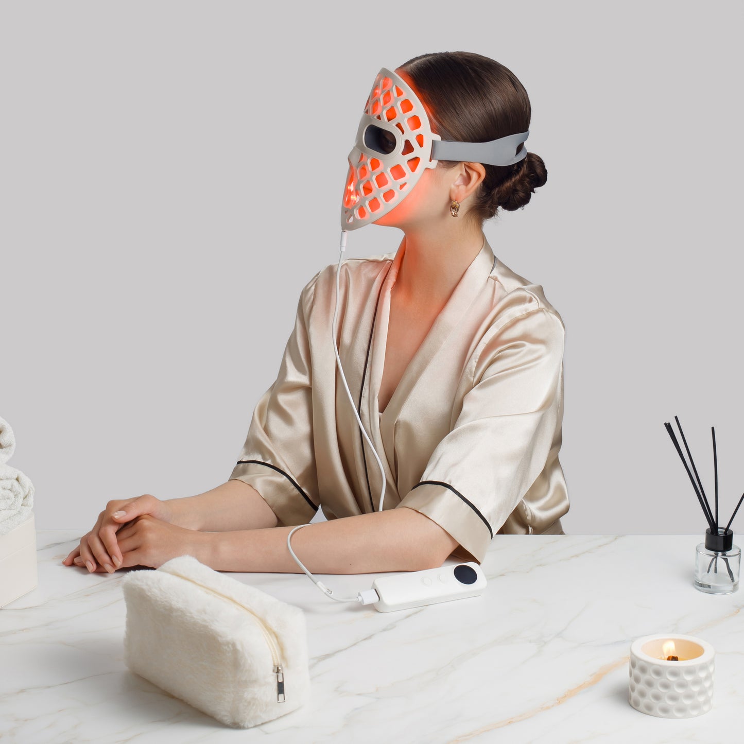 Woman wearing a LED face mask
