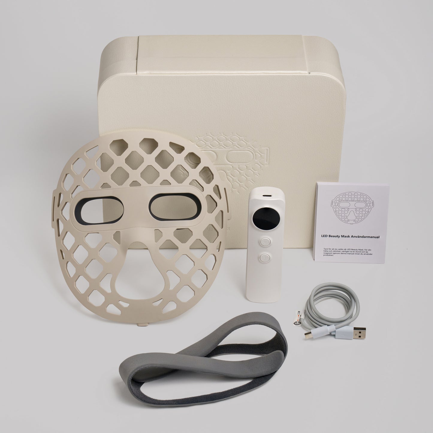 LED face mask, remote control, cable, and user manual