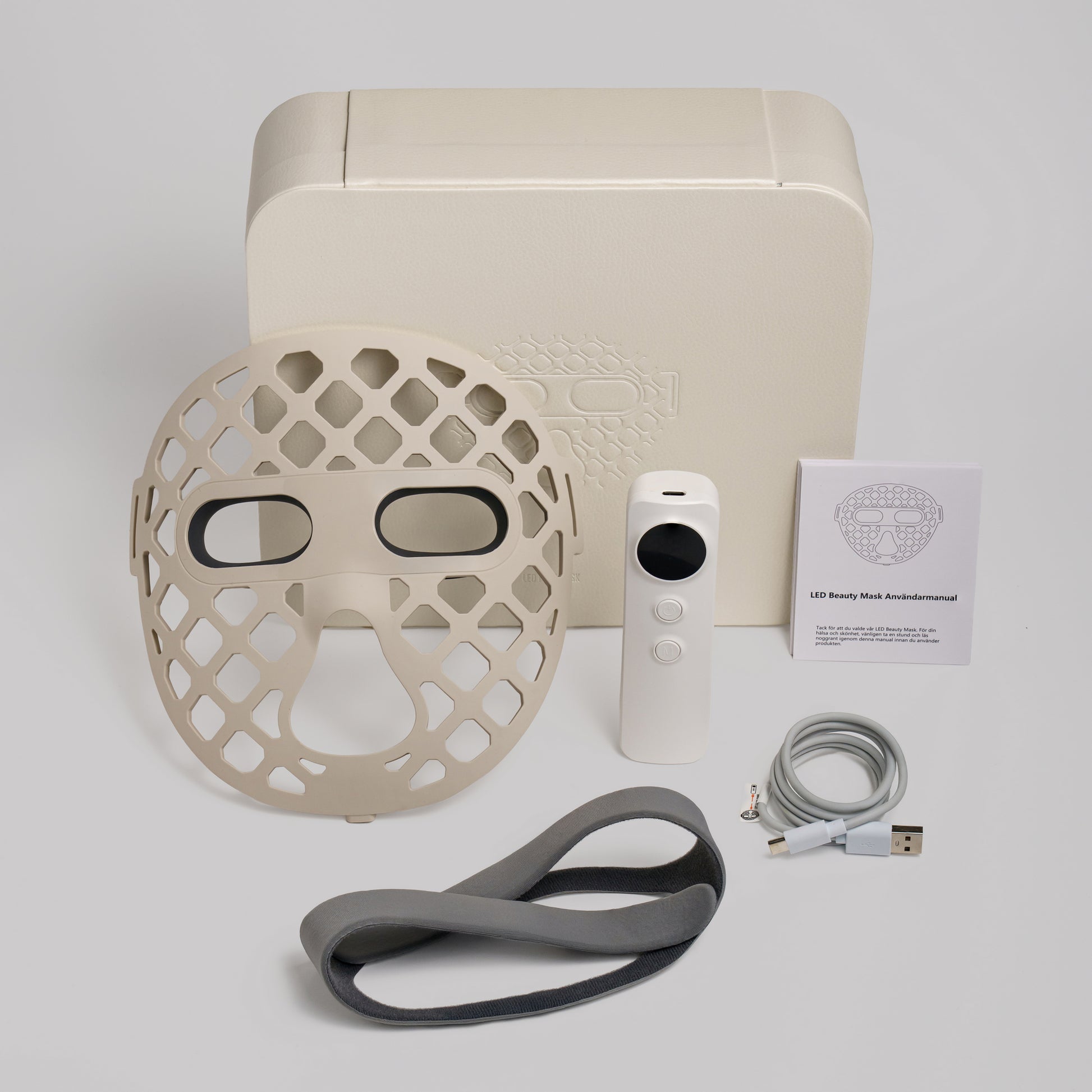 LED face mask, remote control, cable, and user manual